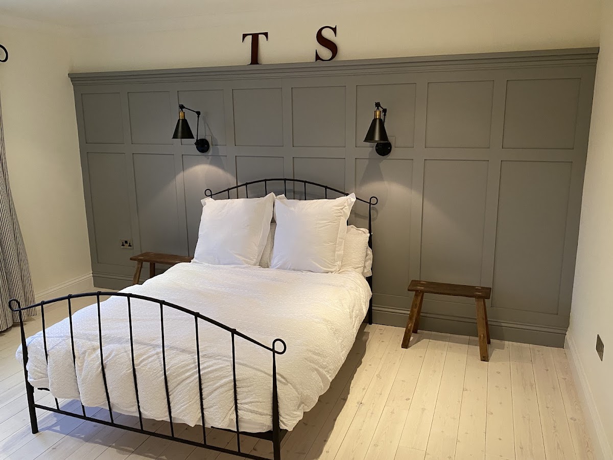 Bedroom feature wall with grey wall panelling