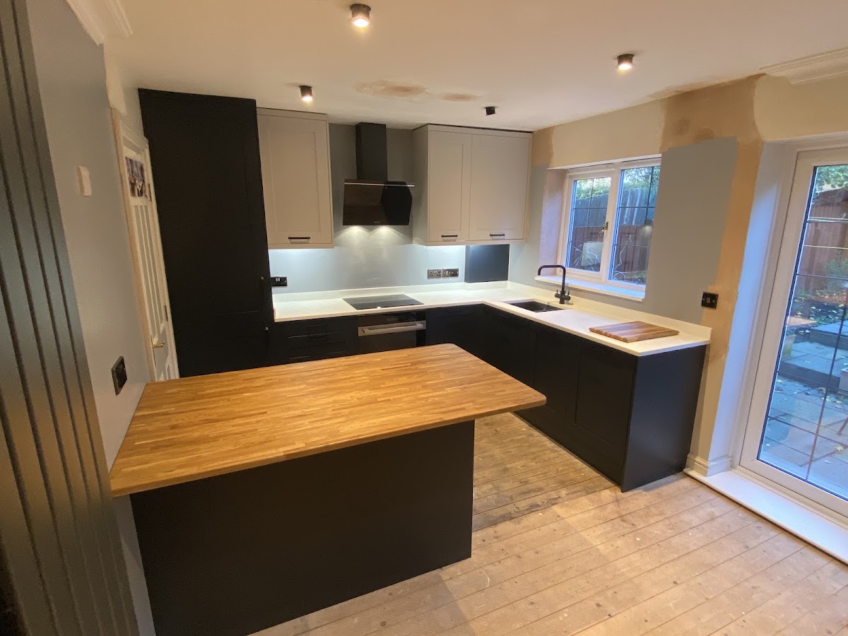 Grey and navy shaker kitchen with a solid oak island top